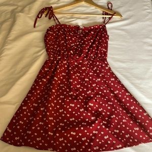 Red mini dress with white and yellow flowers and tie front/spaghetti straps